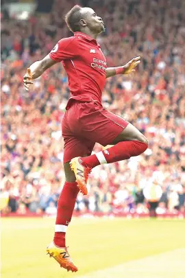  ?? Picture: AFP ?? BRACE. Liverpool’s Sadio Mane celebrates after scoring his second goal in their 4-0 drubbing of West Ham United at Anfield yesterday.