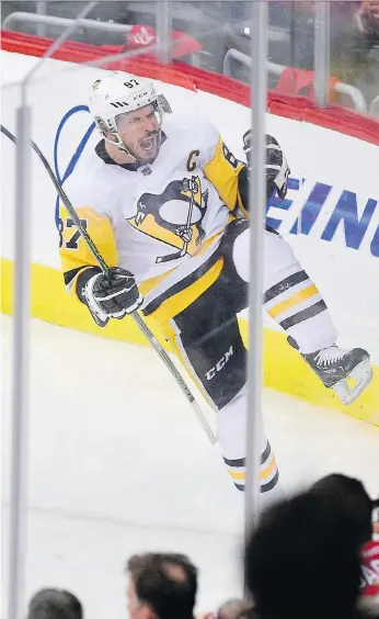  ??  ?? Sidney Crosby scored the tying goal and set up the winner a few minutes later as the Pittsburgh Penguins came from behind to score a 3-2 win over the Capitals in Game 1 Thursday. NICK WASS/THE ASSOCIATED PRESS