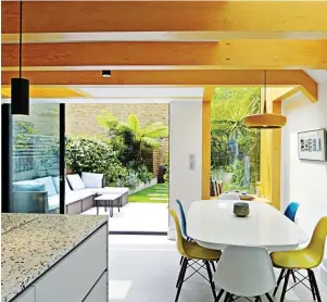  ??  ?? Walk right in: Easy flow between kitchen and outdoors (above); terrazzo worktops (left)