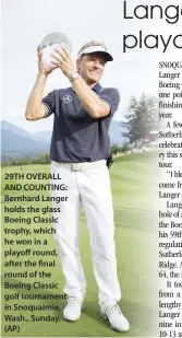  ??  ?? 29TH OVERALL AND COUNTING: Bernhard Langer holds the glass Boeing Classic trophy, which he won in a playoff round, after the final round of the Boeing Classic golf tournament in Snoqualmie, Wash., Sunday. (AP)