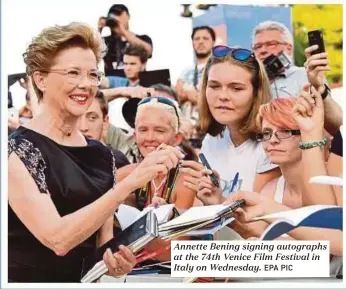  ?? EPA PIC ?? Annette Bening signing autographs at the 74th Venice Film Festival in Italy on Wednesday.