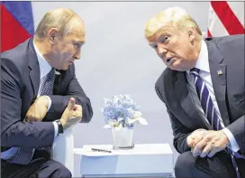  ?? EVAN VUCCI / ASSOCIATED PRESS ?? U.S. President Donald Trump meets with Russian President Vladimir Putin at the G-20 Summit in Hamburg this past week. A U.S.-Russia-brokered truce for southern Syria is meant to help allay growing concerns by neighborin­g Jordan and Israel about Iranian...