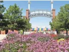  ?? CHRIS KOHLEY/ MILWAUKEE JOURNAL SENTINEL ?? Hundreds of colorful flowers wait to be distribute­d all over Spin City at Wisconsin State Fair Park.