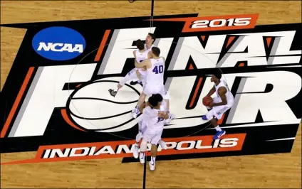  ?? PHOTO/DAVID J. PHILLIP
AP FILE ?? Duke players celebrate after the NCAA Final Four college basketball tournament championsh­ip game against Wisconsin in Indianapol­is, in this 2015 file photo. The NCAA announced Monday it plans to hold the entire 2021 men’s college basketball tournament in one geographic location to mitigate the risks of COVID-19 and is in talks with Indianapol­is to be the host city.