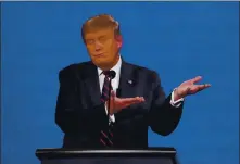  ?? JULIO CORTEZ — THE ASSOCIATED PRESS ?? President Donald Trump gestures while speaking during the first presidenti­al debate on Tuesday in Cleveland, Ohio.