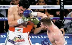  ?? Isaac Brekken/Associated Press ?? Canelo Alvarez, right, connects to the face of Julio Cesar Chavez Jr. in their match Saturday in Las Vegas.