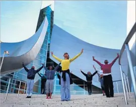  ?? Rick Loomis Los Angeles Times ?? LULA WASHINGTON Dance Theatre dancers in 2015 outside Disney Hall.