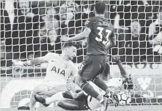  ?? FRANK AUGSTEIN THE ASSOCIATED PRESS ?? Manchester City’s Gabriel Jesus scores during an English Premier League soccer match against Tottenham Hotspur at Wembley Stadium in London on Saturday. Man City won the contest, 3-1.