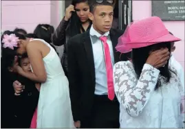  ??  ?? Courtney Pieters’s mother, Juanita Pieters, her brother, Adrian Pieters, and sister Andrea at Courtney’s funeral. The three-year-old Elsies River child, who was raped and killed, allegedly by a man who was a tenant at her family’s home, was laid to...