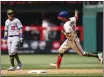  ?? CHRIS SZAGOLA – THE ASSOCIATED PRESS ?? The Phillies’ Garrett Stubbs, right, celebrates his first major league homer as Dodgers third baseman Justin Turner looks on during the sixth inning of Sunday’s game.