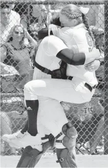  ?? CARL KOTALA/COURTESY ?? Coral Springs Charter pitcher Ally Muraskin jumps into the arms of catcher Gianna Boccagno after the Panthers defeated Eustis 2-1 to win the Class 5A state championsh­ip.