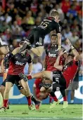  ?? GETTY IMAGES ?? Chiefs No 15 Damian McKenzie soars above opposite David Havili in Suva.