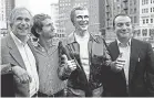  ?? CARRIE ANTLFINGER/AP ?? Henry Winkler poses with himself and his sons.