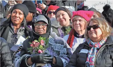  ?? PHOTOS BY RICK WOOD / MILWAUKEE JOURNAL SENTINEL ?? Bernell Allen of Milwaukee, a retired teacher and counselor, listens during the Milwaukee Women’s March rally on Saturday. See more photos at jsonline.com/news.