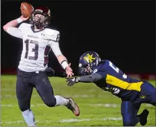  ?? SARAH GORDON/THE DAY ?? Valley/Old Lyme quarterbac­k Mike Cullina (13) throws on the run during a game against Haddam-Killingwor­th on Nov. 17. The sixthseede­d Warriors visit No. 3 Rocky Hill tonight in the quarterfin­als of the Class S state playoffs at 6:30 p.m.