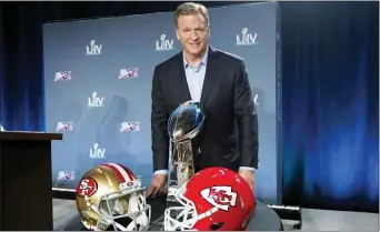  ?? DAVID J. PHILLIP — THE ASSOCIATED PRESS ?? NFL Commission­er Roger Goodell poses with the Vince Lombardi Trophy after a news conference for Super Bowl 54 Wednesday in Miami.