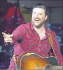 ?? Ethan Miller Getty Images ?? CHRIS YOUNG wants you to know this: He was “Raised on Country.”