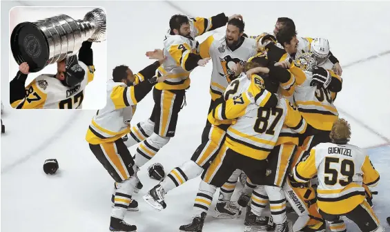  ?? AP PHOTO ?? CLOSE CALL: Sidney Crosby (inset) and the Penguins celebrate after beating the Predators last night to win the Stanley Cup.