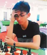  ?? FACEBOOK.COM/NCFPCHESS ?? DANIEL QUIZON (left) and Christian Gian Karlo Arca (right) delivered the worthiest performanc­es of the day to stay in the title hunt in the Philippine National Chess Championsh­ips dubbed ‘The Battle of Grandmaste­rs.’