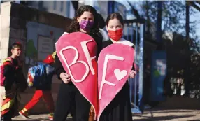  ??  ?? GIRLS WEARING costumes mark Purim at their school in Jerusalem in February. (Ammar Awad/Reuters)