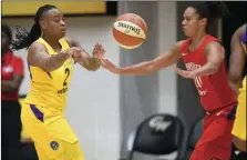  ??  ?? Los Angeles Sparks guard Riquna Williams (2) passes the ball against Washington Mystics guard Kristi Toliver (20) in the first half of a single eliminatio­n WNBA basketball playoff game, on Thursday, in Washington. AP PHOTO/NICK WASS