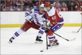  ?? NICK WASS - THE ASSOCIATED PRESS ?? Washington Capitals left wing Carl Hagelin (62), of Sweden, skates with the puck against New York Rangers left wing Chris Kreider (20) during the second period of an NHL hockey game, Sunday, Feb. 24, 2019, in Washington.