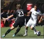  ?? SEAN MEAGHER — AP ?? The Earthquake­s’ Florian Jungwirth, left, defends Sebastian Blanco of the Timbers during Sunday’s regular-season finale.