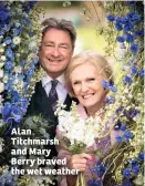  ??  ?? Alan Titchmarsh and Mary Berry braved the wet weather