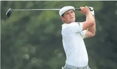  ?? AFP ?? Bryson DeChambeau watches his tee shot on the 18th hole.