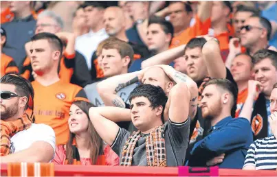  ?? Pictures: Kris Miller. ?? Dejected United fans at the full-time whistle.