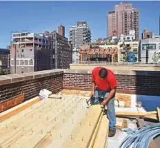  ?? AFP ?? Wooden tanks are a part of New York’s skyline and millions of people unknowingl­y depend on them.