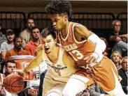  ?? Evan Brown / Tulsa World ?? UT’s Jase Febres gets too close to Oklahoma State's Thomas Dziagwa, drawing a foul in three-point loss.