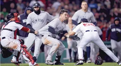  ?? AP ?? The Yankees’ Tyler Austin rushes Red Sox reliever Joe Kelly after being hit by a pitch in the seventh inning Wednesday.