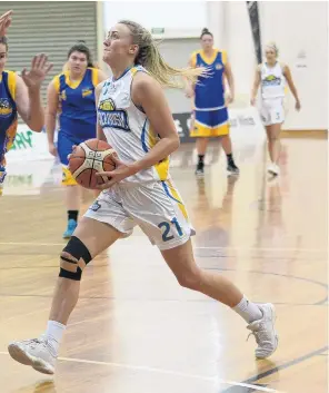  ?? PHOTO: LINDA ROBERTSON ?? Foul time . . . Tauranga City Coasters player Texi Schaeffer moves in front of Otago Goldrush’s Nicole Ruske and fouls her in a women’s basketball championsh­ip match at the Edgar Centre yesterday.