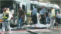  ?? (Marc Israel Sellem/The Jerusalem Post) ?? RESCUE PERSONNEL gather the wounded and the dead from the terrorist attack on a Jerusalem No. 78 bus in the capital’s Armon Hanatziv neighborho­od in October 2015.