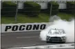  ?? MATT SLOCUM - THE ASSOCIATED PRESS ?? Chase Briscoe smokes his tires in celebratio­n after winning a NASCAR Xfinity Series auto race at Pocono Raceway on Sunday in Long Pond, Pa.