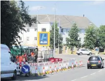  ??  ?? Busy Parts of Wellhall Road is coned off for repair works