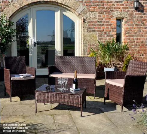  ??  ?? This stylish four-piece furniture set is ideal for alfresco entertaini­ng