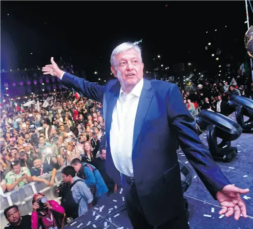  ?? PEDRO PARDO / AFP / GETTY IMAGES ?? Newly elected Mexican President Andres Manuel López Obrador, running for the “Juntos haremos historia” party, cheers his supporters at the Zocalo Square in Mexcio City Sunday after emerging victorious in the country’s election.