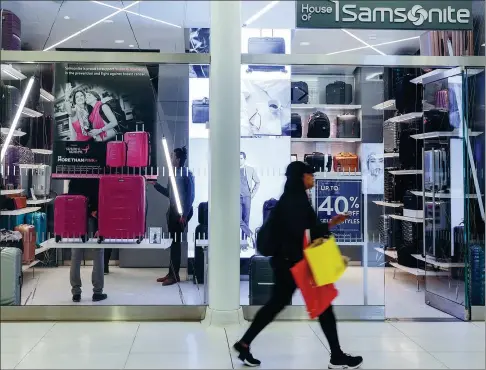  ?? SARAH BLESENER / BLOOMBERG ?? A pedestrian walks past a Samsonite Internatio­nal SA store in New York City, US.