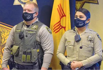  ?? JIM THOMPSON/JOURNAL ?? Deputies Connor Otero and Angelina Navarro are each wearing a BodyWorn camera tucked into a hidden pocket in their uniforms and vests.