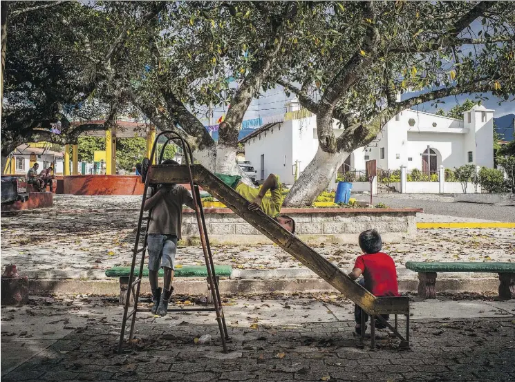  ?? PHOTOS: DANIELE VOLPE/THE WASHINGTON POST ?? Children play at a park in Chanmagua, Guatemala, where the absence of kids in sports, and coffee farms with thinner staffs are both evident.