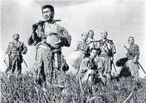  ??  ?? Toshiro Mifune, second from left, in a scene from the historical epic Seven Samurai (1954), on which Hashimoto, right, collaborat­ed with Akira Kurosawa