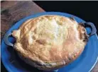  ??  ?? The port-o-pot pie is filled with mushrooms, carrots, onions, celery and spinach.
