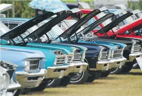  ?? PNG ?? Rows of cars sit with their hoods up to show off their engines at the West Coaster Daze held at Semiahmoo Park in White Rock.