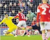  ??  ?? TYKE THAT Conor Chaplin scores Barnsley’s winning goal