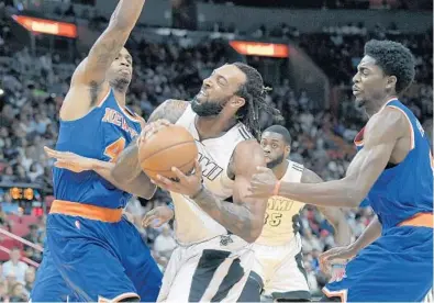  ?? MICHAEL LAUGHLIN/STAFF PHOTOGRAPH­ER ?? Heat forward Derrick Williams tries to drive to the basket against two Knicks defenders on Tuesday night at AmericanAi­rlines Arena. .