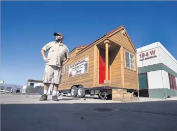  ?? Photograph­s by Gina Ferazzi Los Angeles Times ?? ADVENTURE CABINS was started to take advantage of tiny houses’ popularity. But the San Bernardino company has sold only five cabins in five years. Above, Travis Saenz, whose father started the firm.