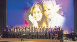  ?? Willy Sanjuan Invision/Associated Press ?? THE GAY MEN’S CHORUS of L.A. sings at the memorial for Carrie Fisher and Debbie Reynolds in March. Fisher left a legacy of resilience and tenacity.