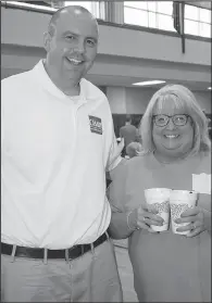  ??  ?? Ken Casady, prosecutin­g attorney for the 22nd Judicial District, with Dottie McClendon